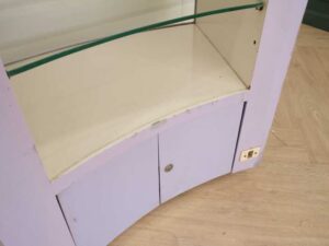 Curved glass jewelry showcase cabinet in purple color, without glass door.