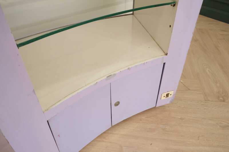 Curved glass jewelry showcase cabinet in purple color, without glass door.