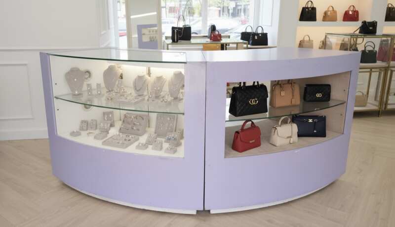 Curved glass jewelry showcase cabinet in purple color, without glass door.