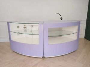 Curved glass jewelry showcase cabinet in purple color, without glass door.