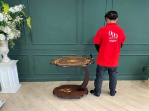 Serving table with wheels, wooden frame, brown