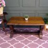 Multi-purpose table wood carving European work comes from Germany.