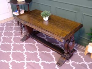 Multi-purpose table wood carving European work comes from Germany.