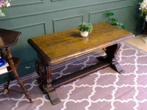 Multi-purpose table wood carving European work comes from Germany.