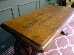 Multi-purpose table wood carving European work comes from Germany.