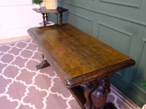 Multi-purpose table wood carving European work comes from Germany.