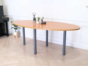 Conference table, steel legs, wooden top, oval shape.