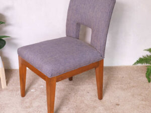 Wooden chair, purple fabric cushion, beautiful frame, cushioned backrest.