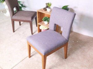 Wooden chair, purple fabric cushion, beautiful frame, cushioned backrest.