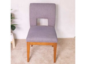 Wooden chair, purple fabric cushion, beautiful frame, cushioned backrest.