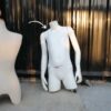 Boys' white shirt displayed on mannequin.