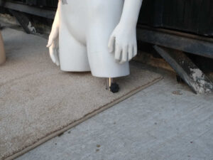 Boys' white shirt displayed on mannequin.