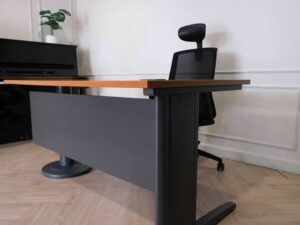 Wooden desk with steel legs, curved front, one side, brand Rockworth._