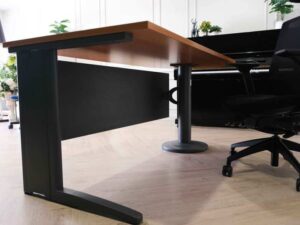 Wooden desk with steel legs, curved front, one side, brand Rockworth._
