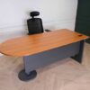 Wooden desk with steel legs, curved front, one side, brand Rockworth._