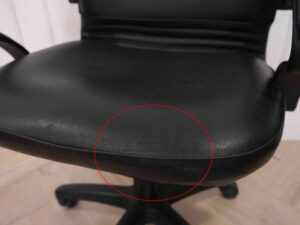Chair, leather seat, curved backrest.