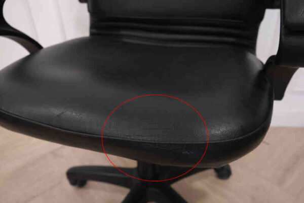 Chair, leather seat, curved backrest.