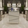 Jewelry cabinet, glass cabinet to display products The base is designed with a stainless steel cut glass pattern. There is a storage cabinet with 1 door that opens in a gray stone pattern.