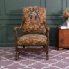 Carved chair, Louis style, fabric cushion with feminine floral pattern. European work comes from Germany.