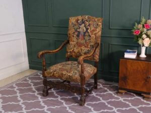 Carved chair, Louis style, fabric cushion with feminine floral pattern. European work comes from Germany.