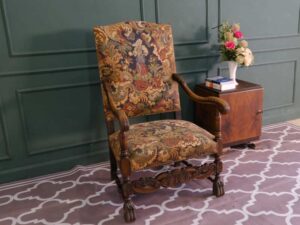 Carved chair, Louis style, fabric cushion with feminine floral pattern. European work comes from Germany.