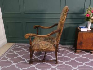 Carved chair, Louis style, fabric cushion with feminine floral pattern. European work comes from Germany.