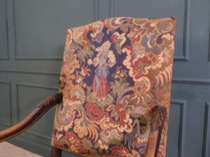 Carved chair, Louis style, fabric cushion with feminine floral pattern. European work comes from Germany.