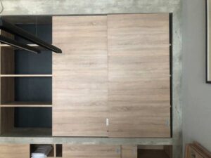 Built-in sliding door, wood pattern, minimalist style, maple color.