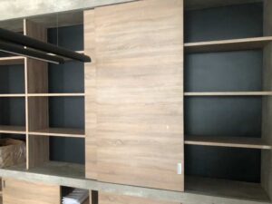 Built-in sliding door, wood pattern, minimalist style, maple color.