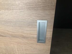 Built-in sliding door, wood pattern, minimalist style, maple color.