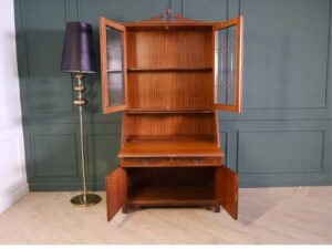 Vintage style bookcase, mahogany color. European work comes from Germany.