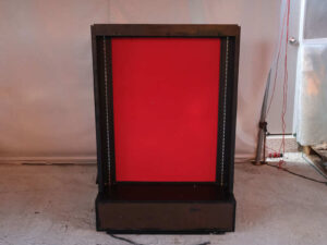 Product shelf Without shelves (black-red), wooden frame, with storage drawers.