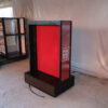 Product shelf Without shelves (black-red), wooden frame, with storage drawers.