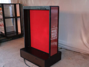 Product shelf Without shelves (black-red), wooden frame, with storage drawers.