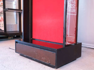Product shelf Without shelves (black-red), wooden frame, with storage drawers.