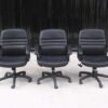 Office chair, black leather seat, leather covered arms, brand Mono.