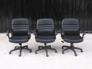 Office chair, black leather seat, leather covered arms, brand Mono.