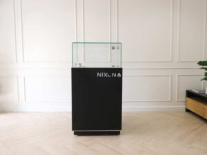 Jewelry cabinet, glass cabinet to display products Square shape, black wooden base, has 2 storage cabinets that open.