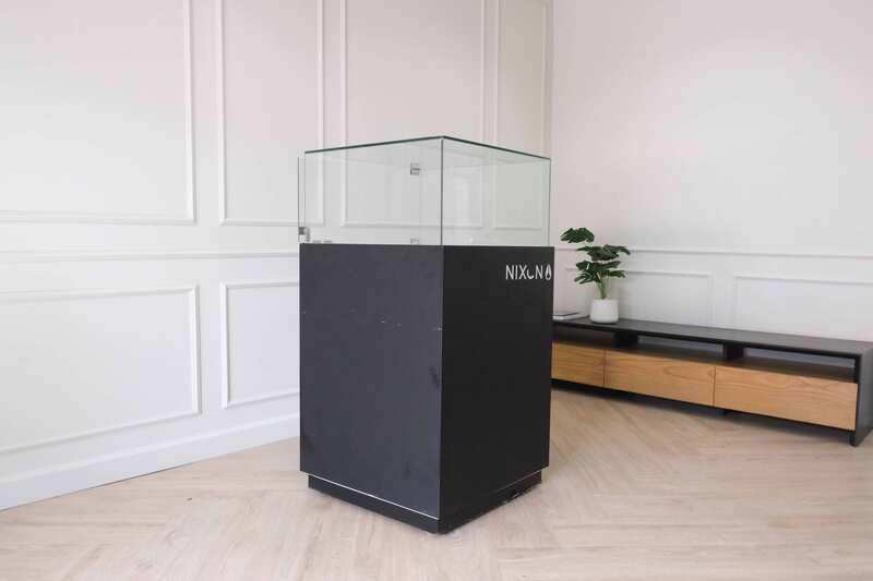 Jewelry cabinet, glass cabinet to display products Square shape, black wooden base, has 2 storage cabinets that open.