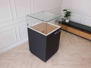 Jewelry cabinet, glass cabinet to display products Square shape, black wooden base, has 2 storage cabinets that open.