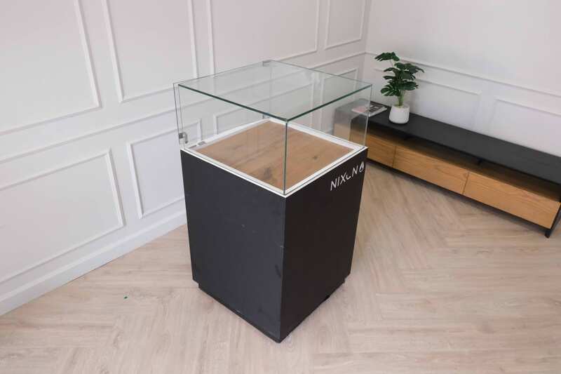 Jewelry cabinet, glass cabinet to display products Square shape, black wooden base, has 2 storage cabinets that open.
