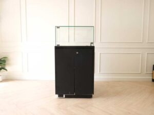 Jewelry cabinet, glass cabinet to display products Square shape, black wooden base, has 2 storage cabinets that open.