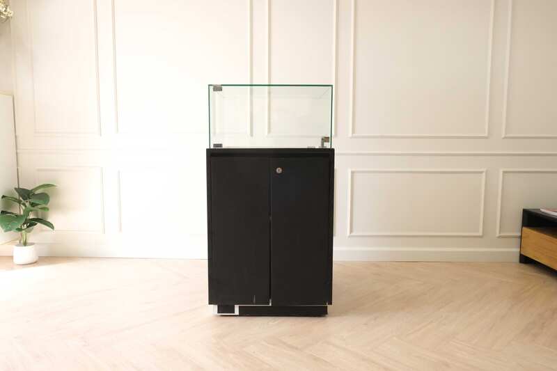 Jewelry cabinet, glass cabinet to display products Square shape, black wooden base, has 2 storage cabinets that open.