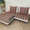 2 seat sofa, cream leather seats Covered with striped fabric