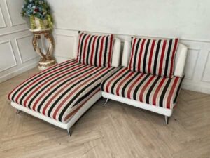 2 seat sofa, cream leather seats Covered with striped fabric