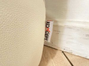 2 seat sofa, cream leather seats Covered with striped fabric