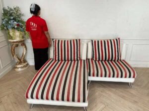 2 seat sofa, cream leather seats Covered with striped fabric