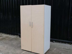 Wooden cabinet with 2 doors, cream color, wavy design.