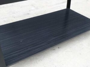 Multipurpose table with 2 levels, black wood pattern top. Black steel leg frame