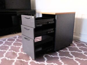 Wooden filing cabinet, 3 drawers, gray color, wooden top, no wheels.